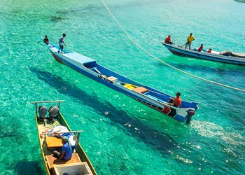Local Water Taxis, Known As Feeder Boats Operate In The Crystal Clear Turquoise Sea Of Atauro Island